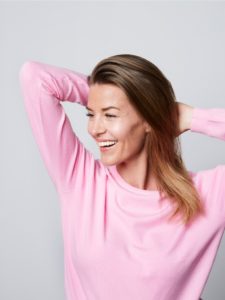 smiling woman in pink picture id1163683530 copy