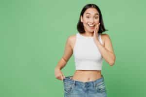 Woman looking happy, showing her weight loss and body contouring in Salt Lake City