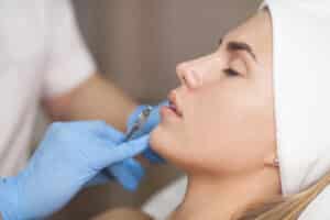 Woman getting dermal fillers to restore youthful look after weight loss in Salt Lake City