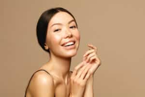 Woman with dewy, smooth skin from microneedling with exosomes in Salt Lake City, UT